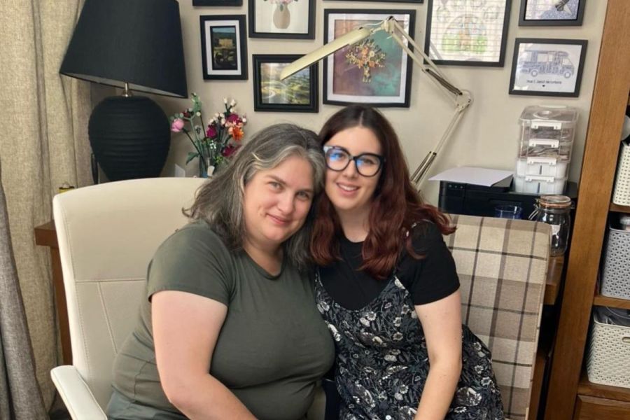 2 people sitting closely